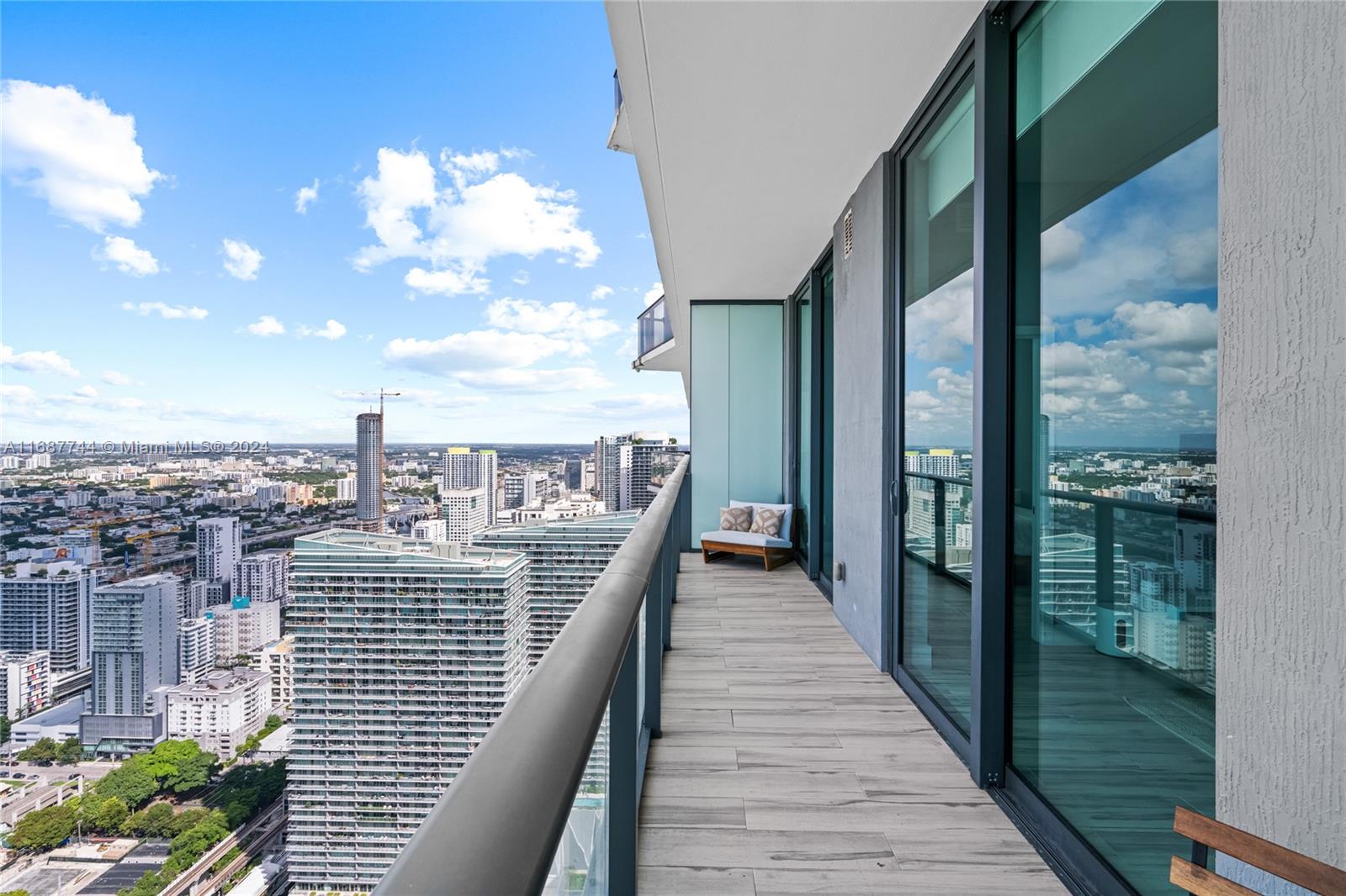 a view of a balcony with wooden floor