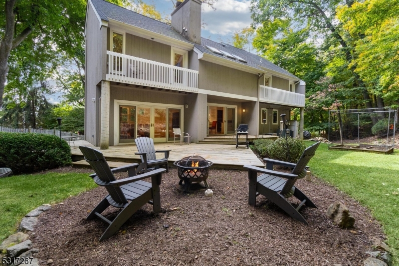 a view of a house with backyard sitting area and garden