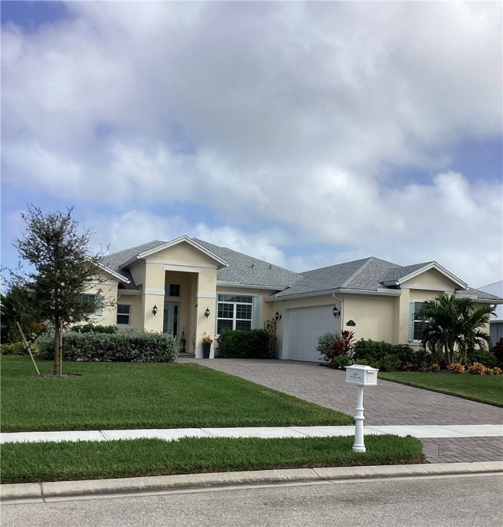 a front view of a house with a yard