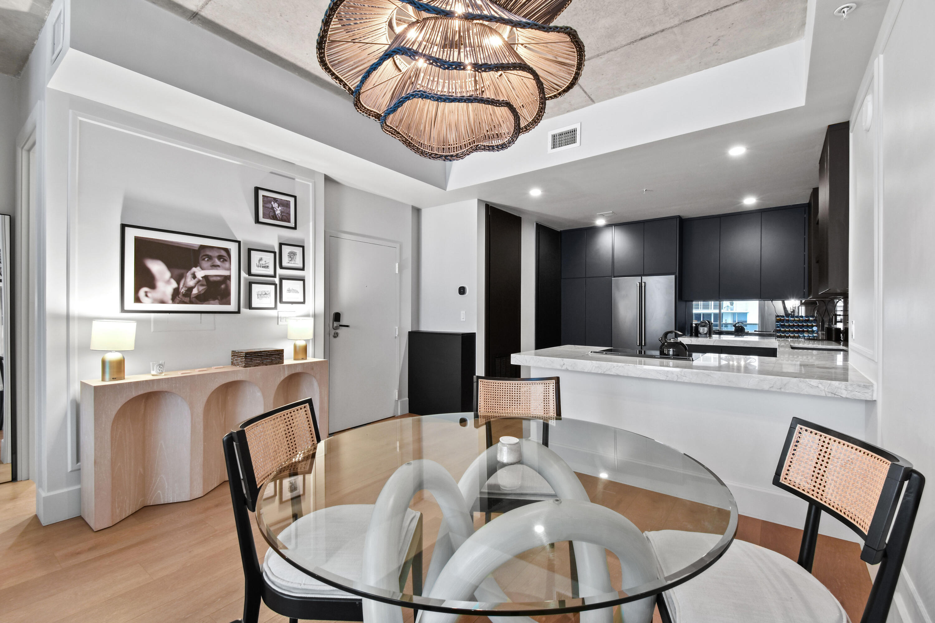 a large kitchen with a table and chairs