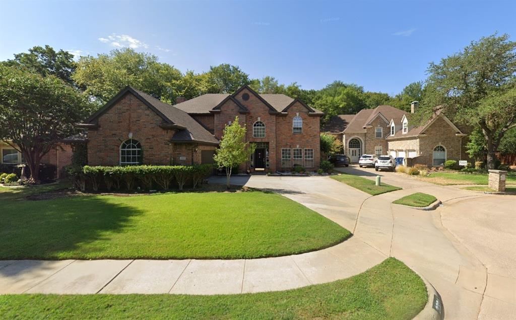 a view of a white house with a swimming pool and a yard