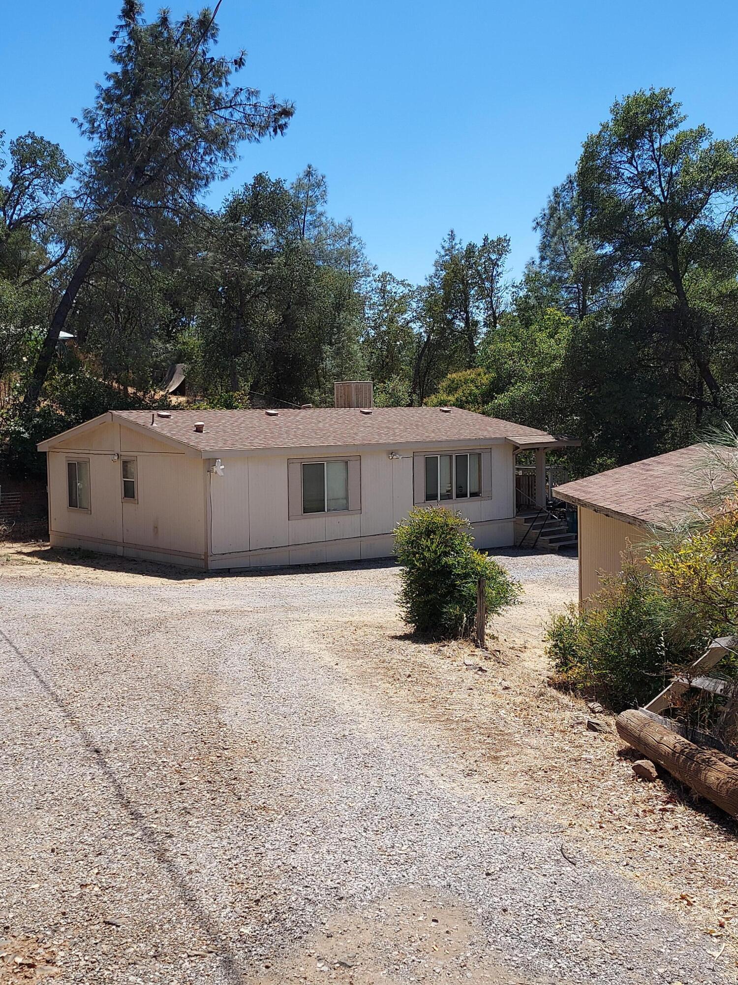 a house with trees in the background