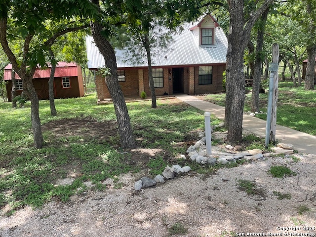 a front view of house with small garden