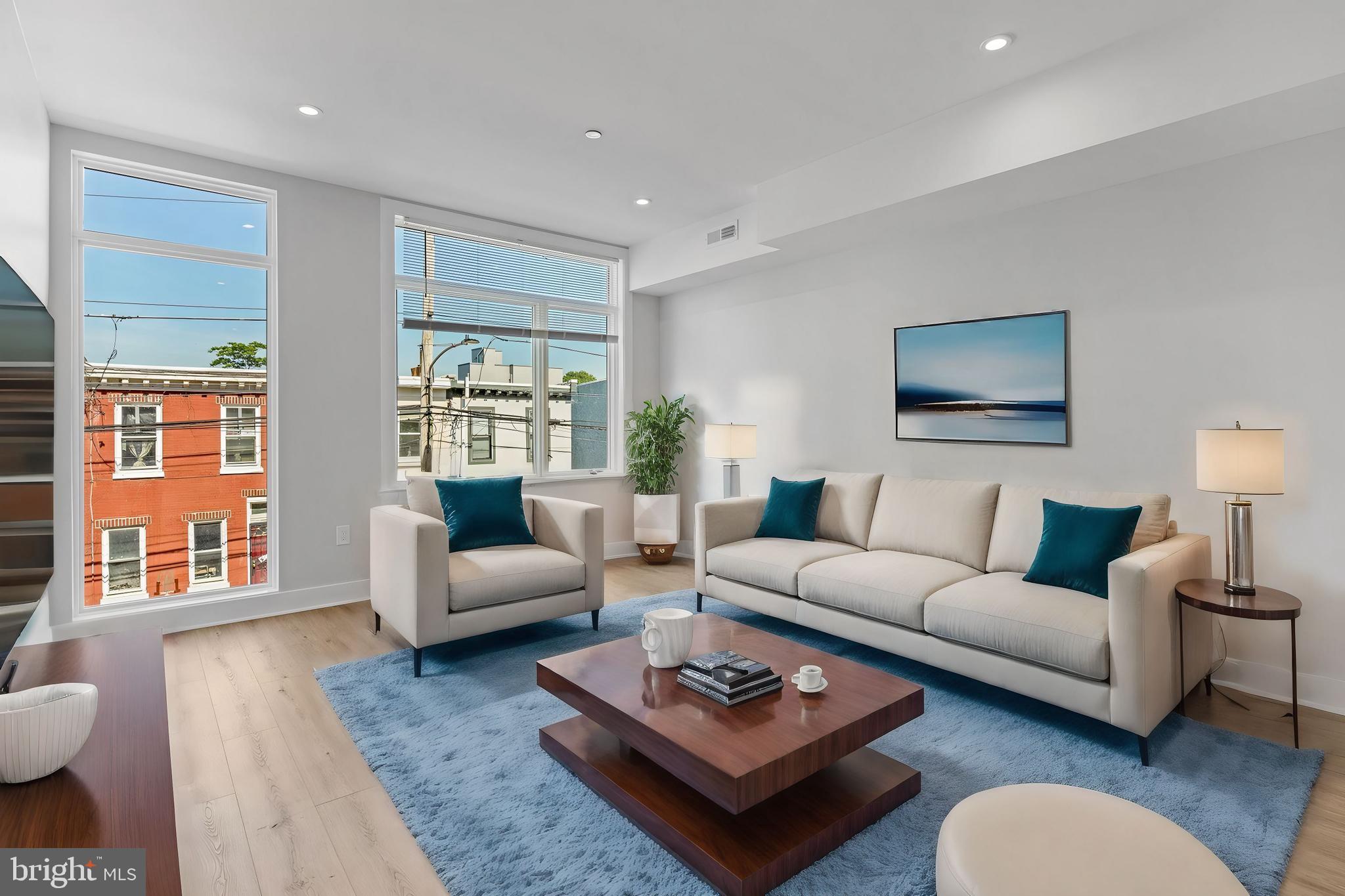 a living room with furniture a rug and a large window