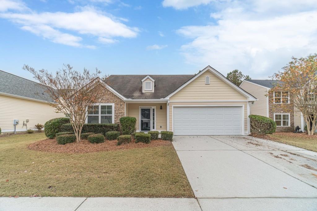 a view of house with yard and entertaining space