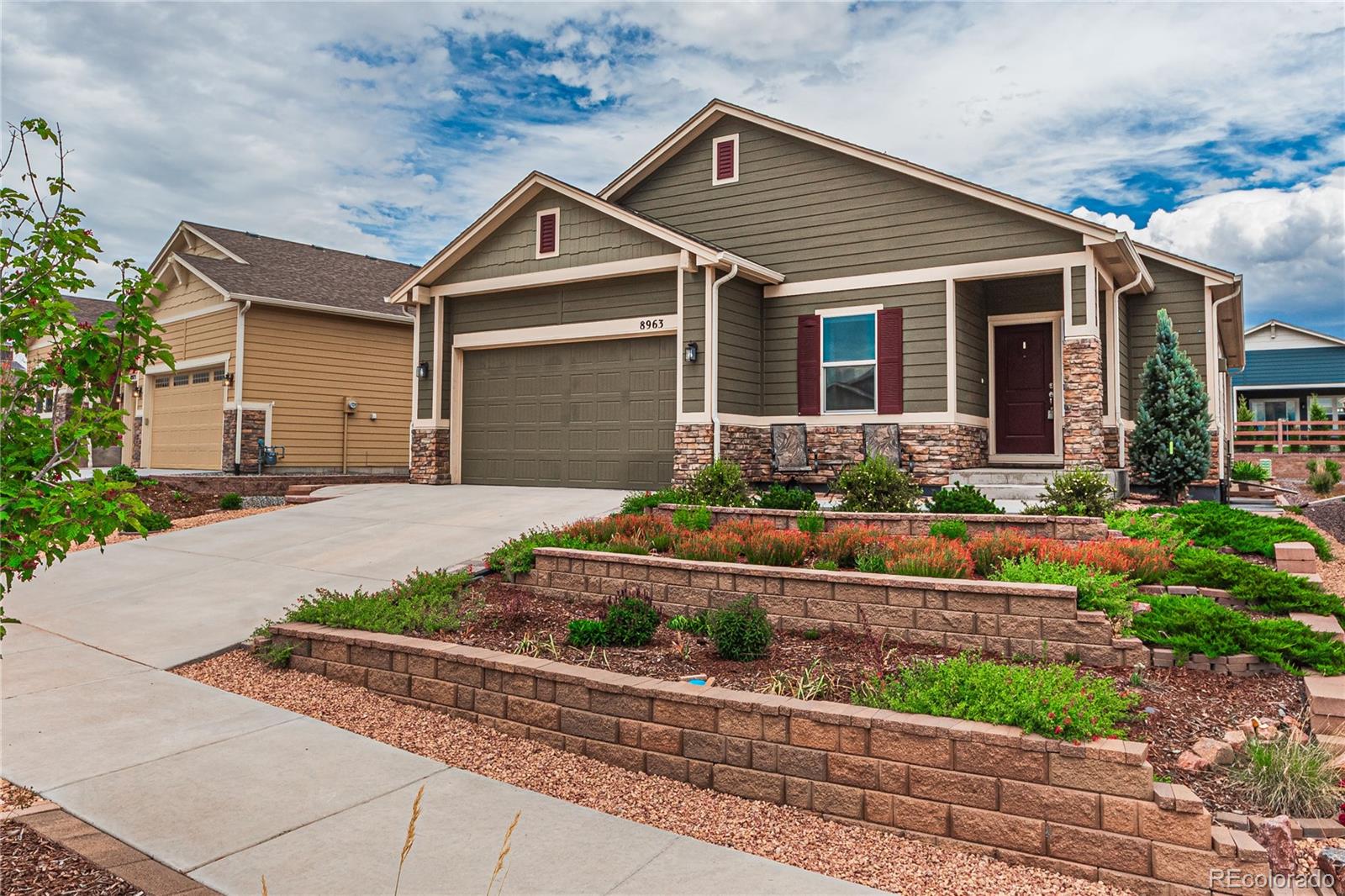 a front view of a house with a yard