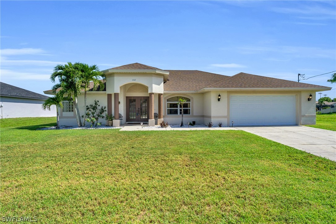 a view of a house with a backyard