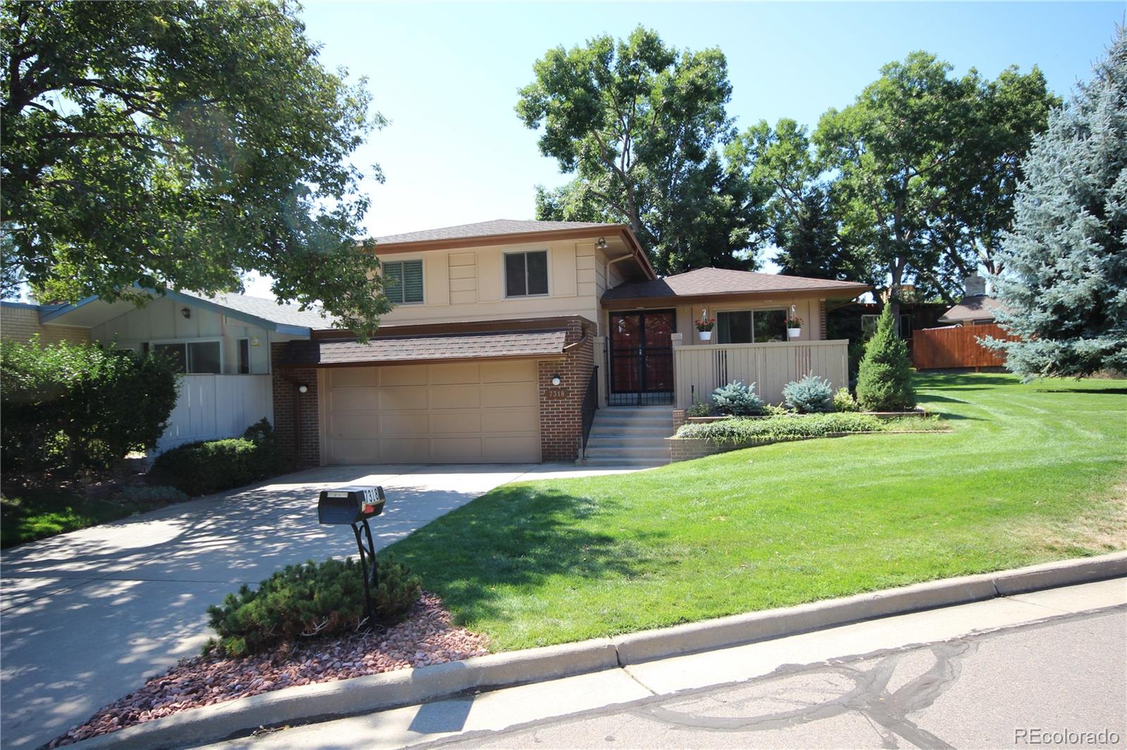 a front view of house with yard and outdoor seating