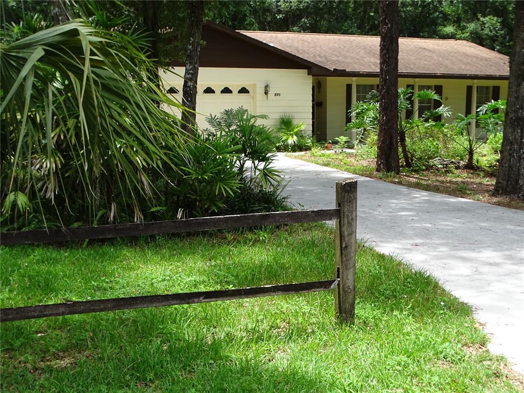 a view of a back yard of the house