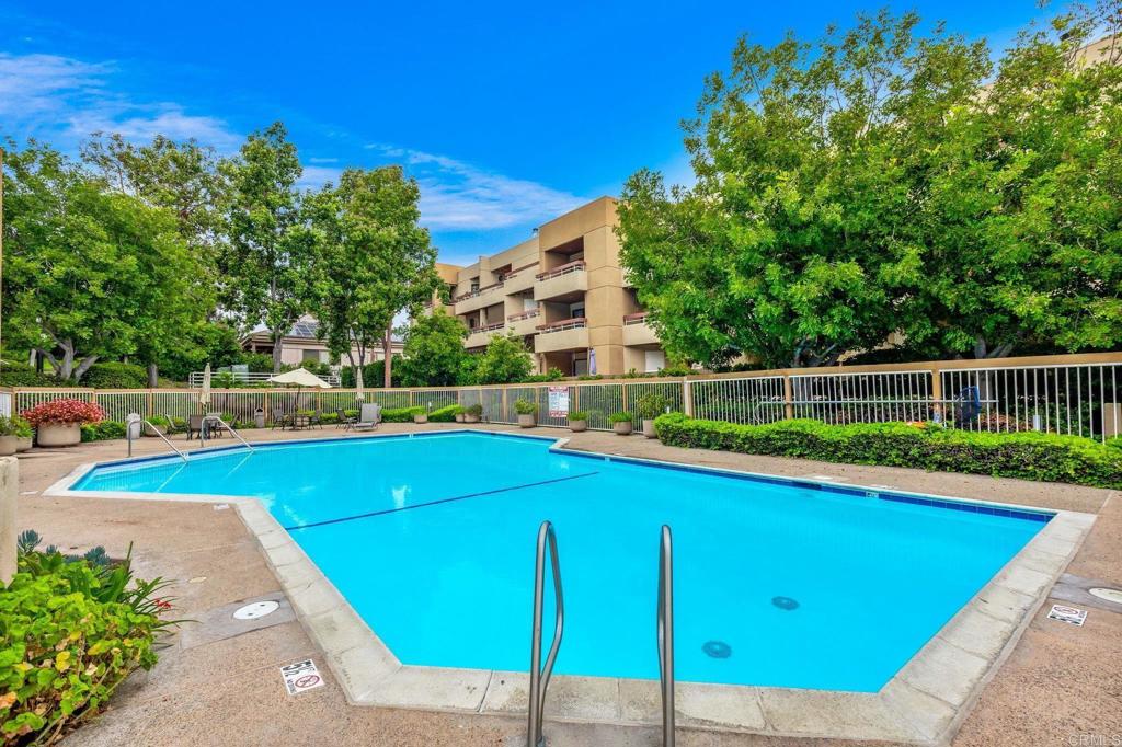 a view of a swimming pool with a lounge chair