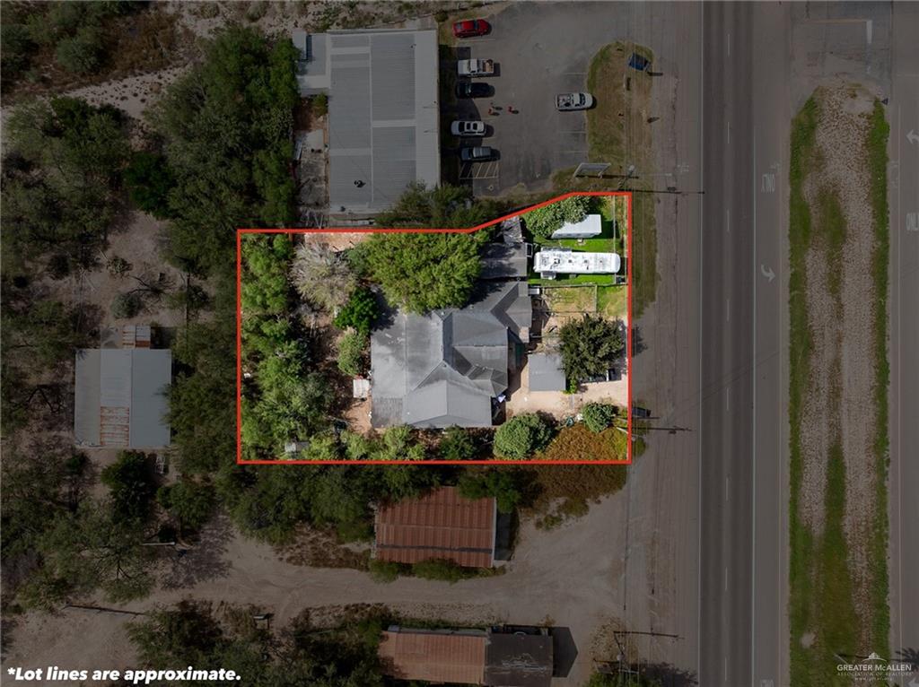 an aerial view of a residential houses with outdoor space