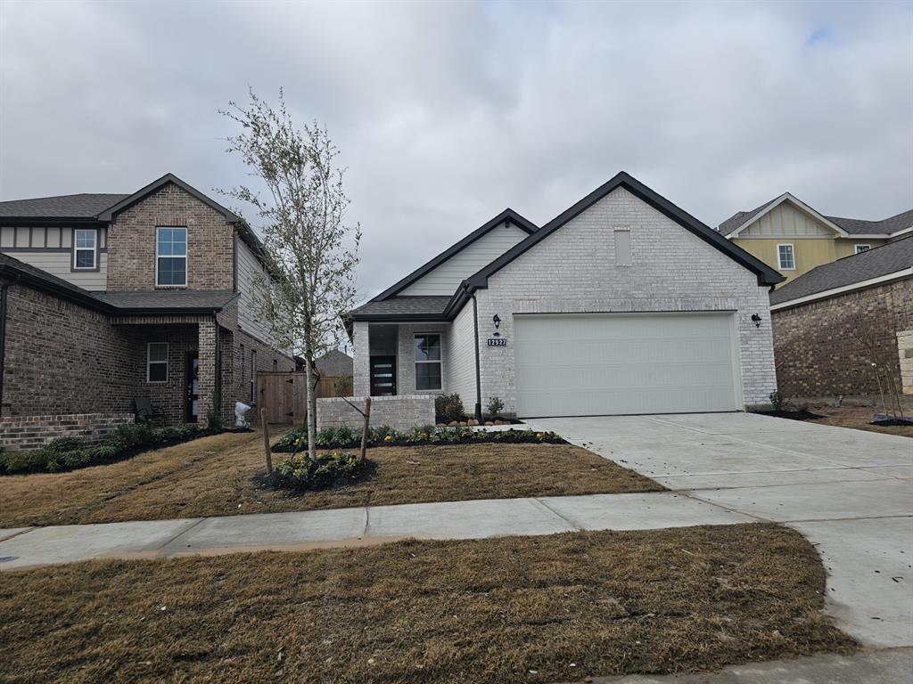 a front view of a house with garage