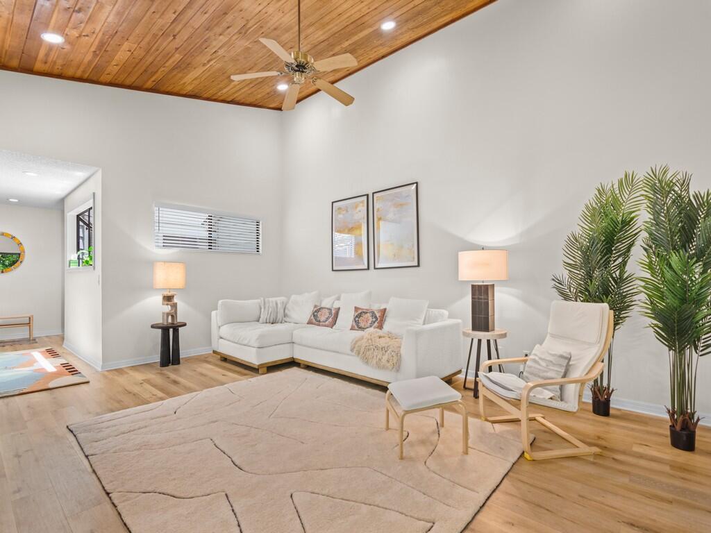 a living room with furniture and a lamp