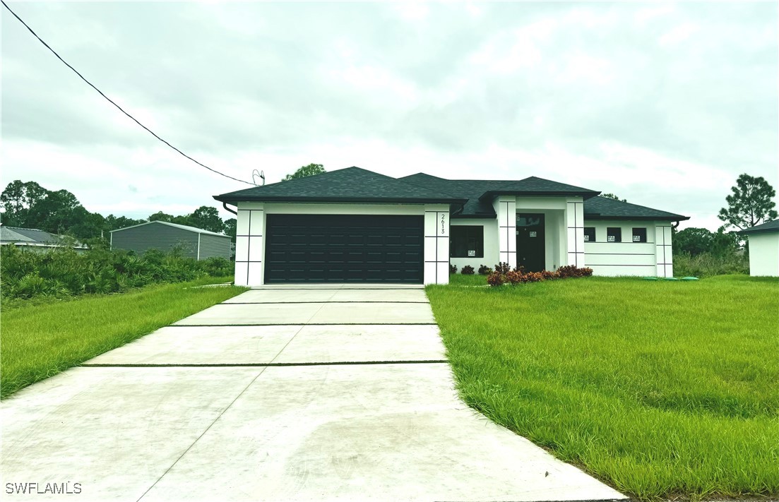 a front view of house with yard and green space