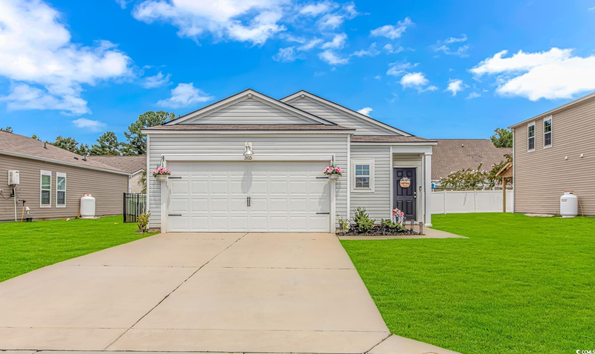 View of front of property featuring a front yard a