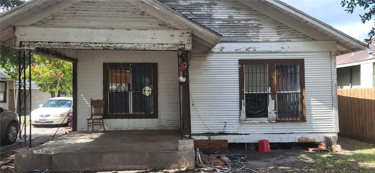 a front view of a house with parking space