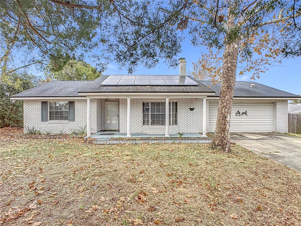 front view of house with a tree