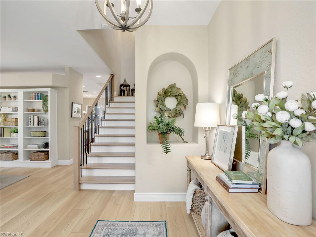 a view of living room with furniture and wooden floor