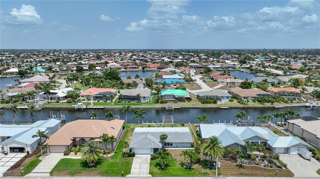 an aerial view of a house with a lake view