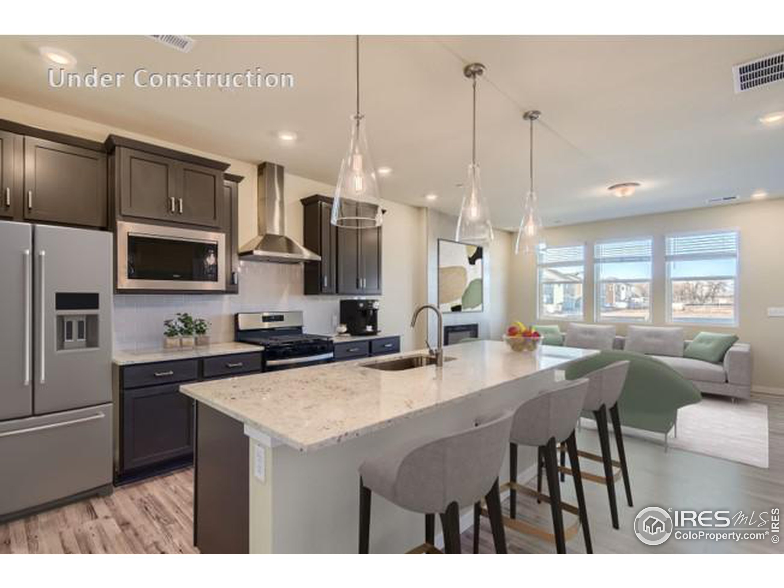 a kitchen with stainless steel appliances kitchen island granite countertop a sink a stove and a refrigerator