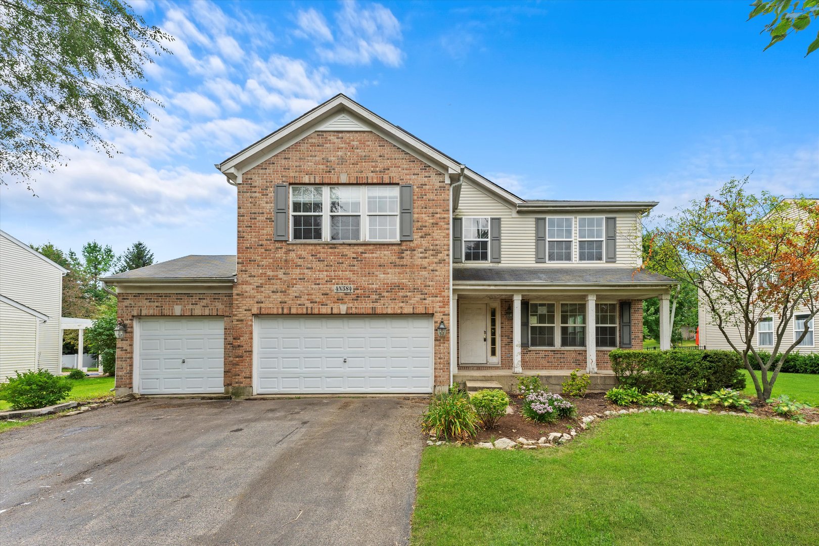 front view of a house with a yard