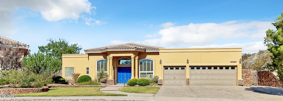 a front view of a house with garden