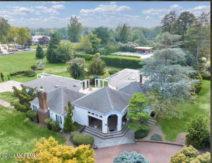 an aerial view of a house with outdoor space and street view