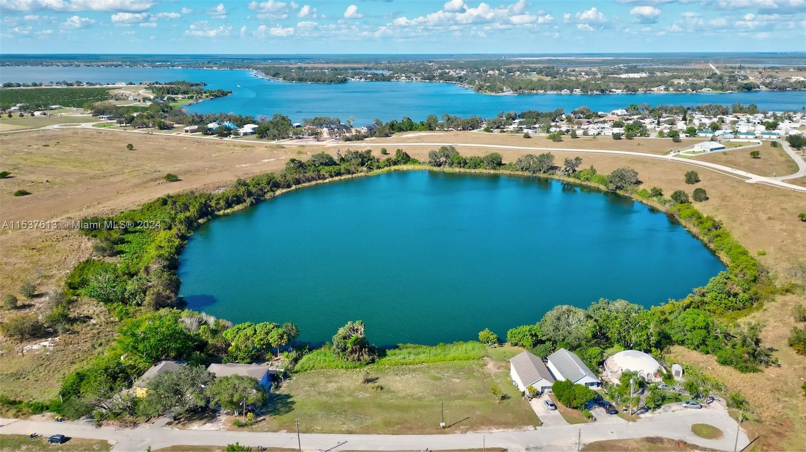 an aerial view of lake residential houses with outdoor space