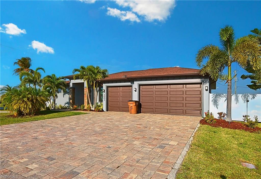 Single story home featuring a garage