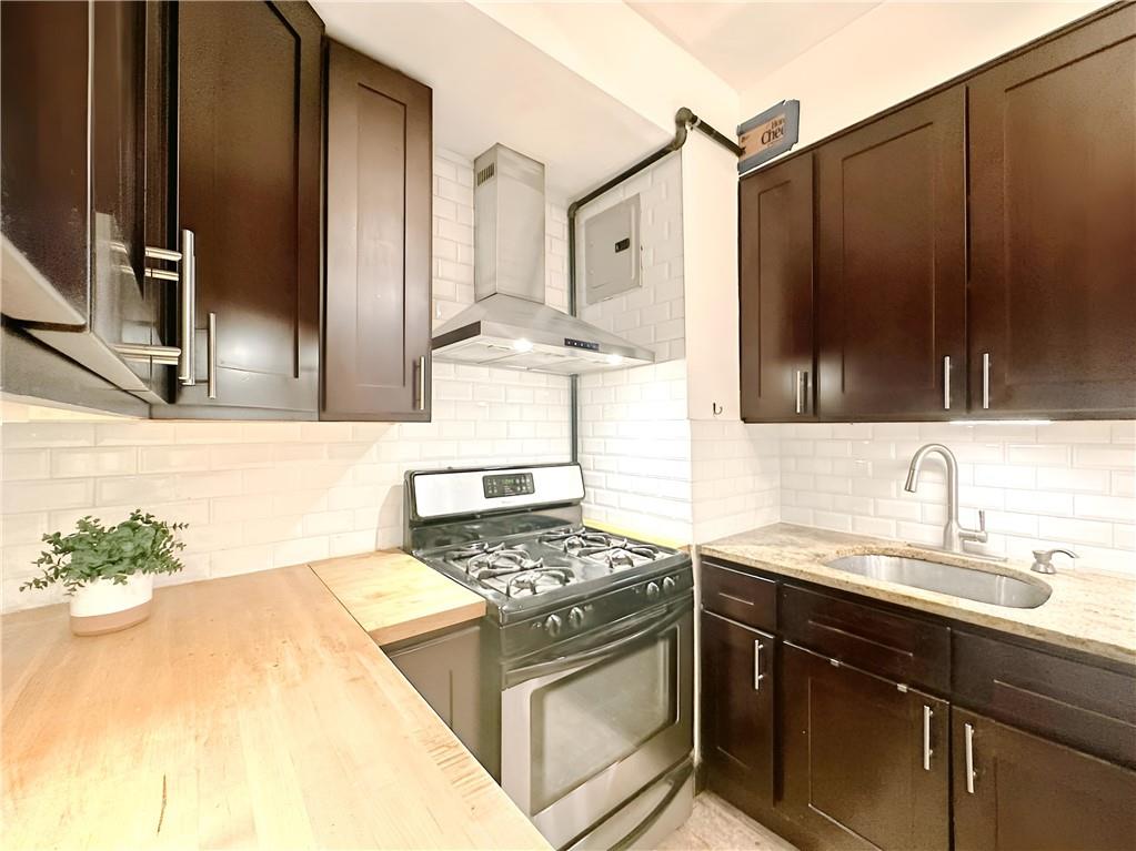 a kitchen with a sink stove and refrigerator