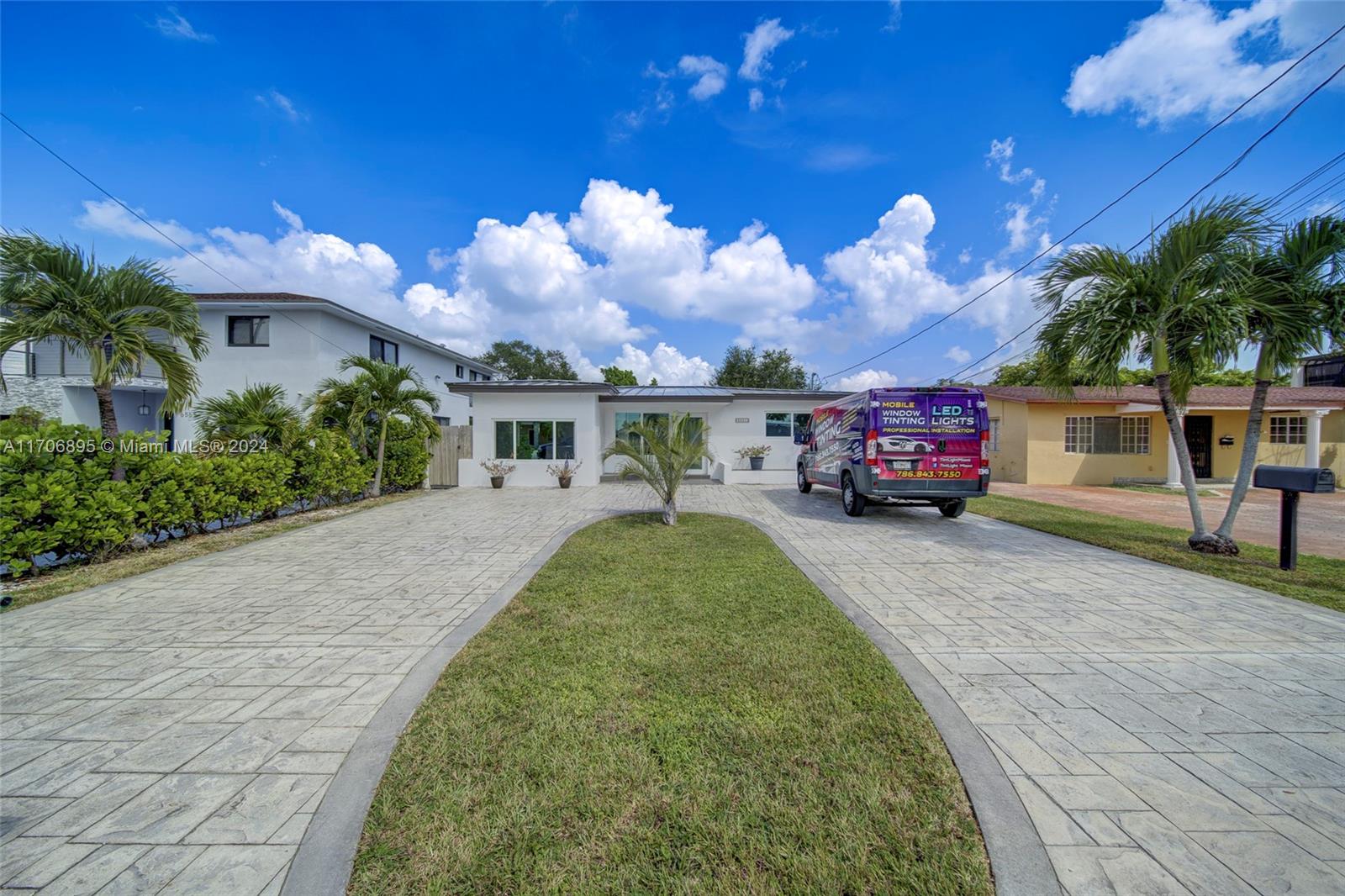 a view of a house with a cars park