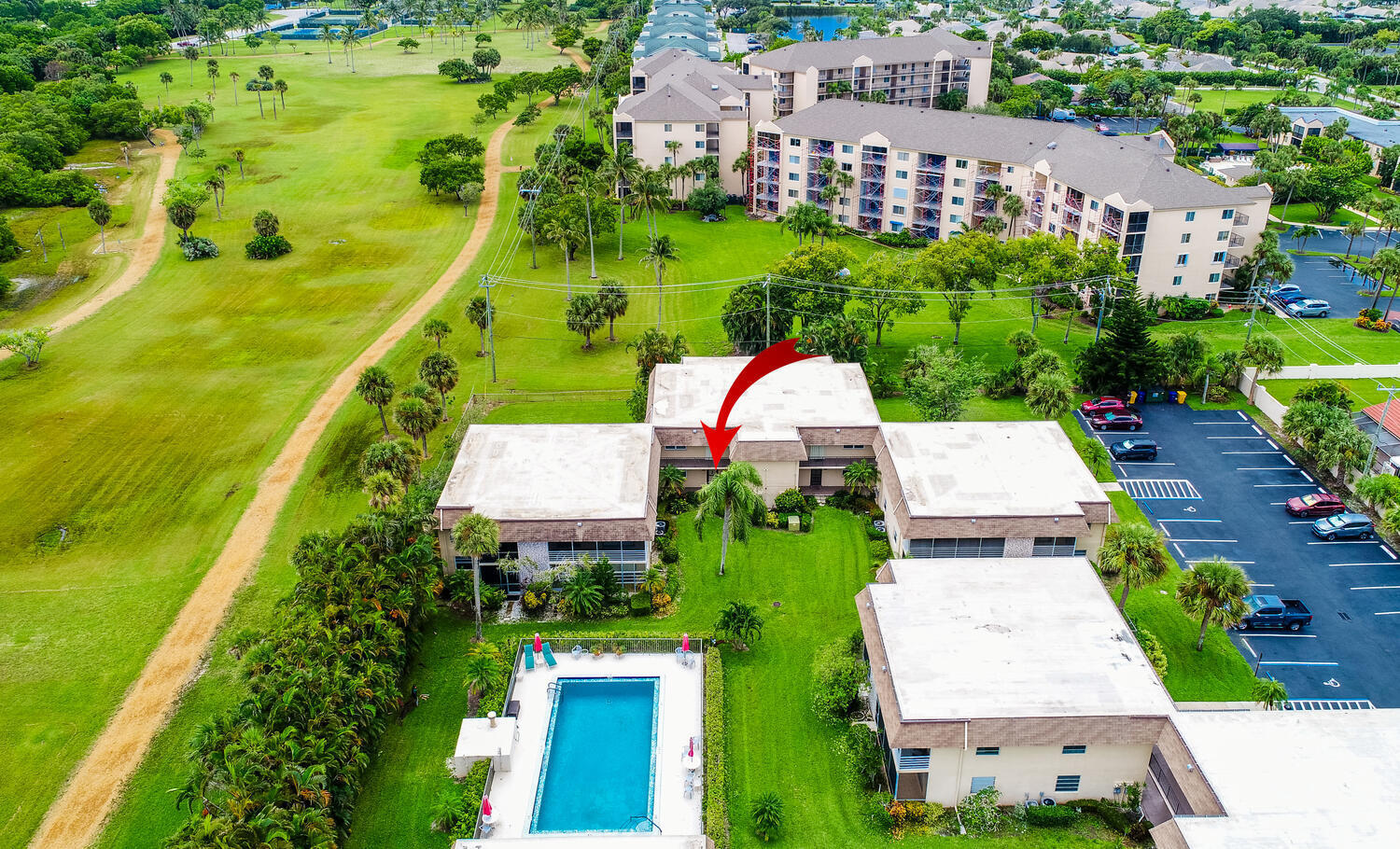 an aerial view of a house with a garden and swimming pool