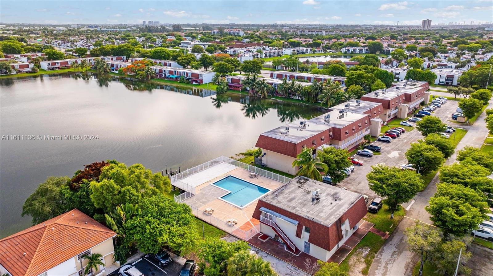 an aerial view of a house with a lake view