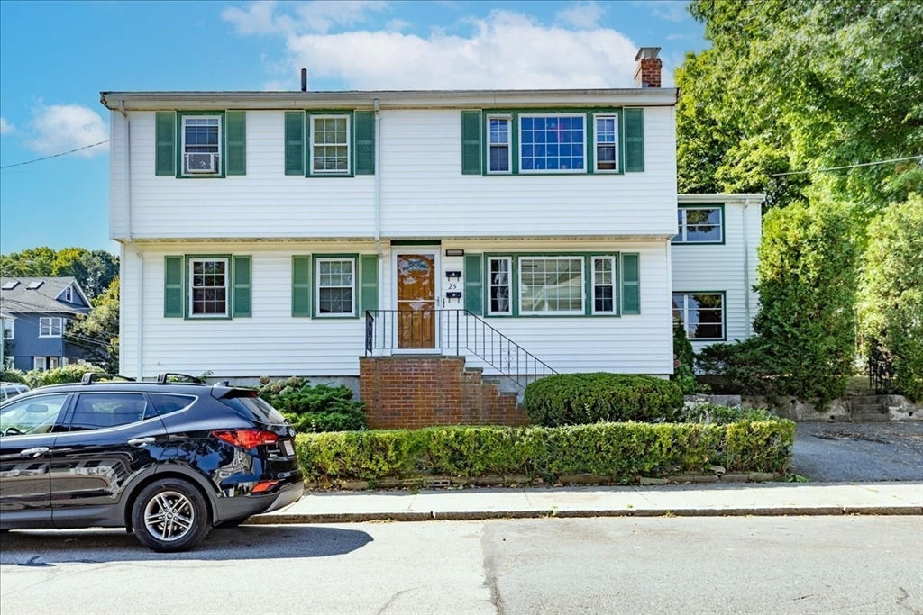 a car parked in front of a house