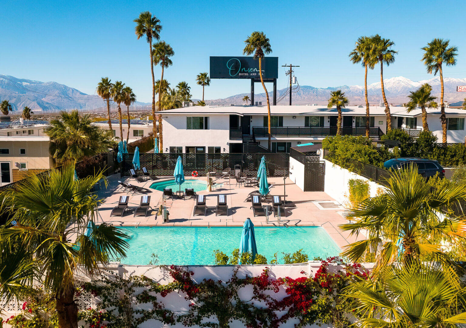 a view of a swimming pool and lounge chair