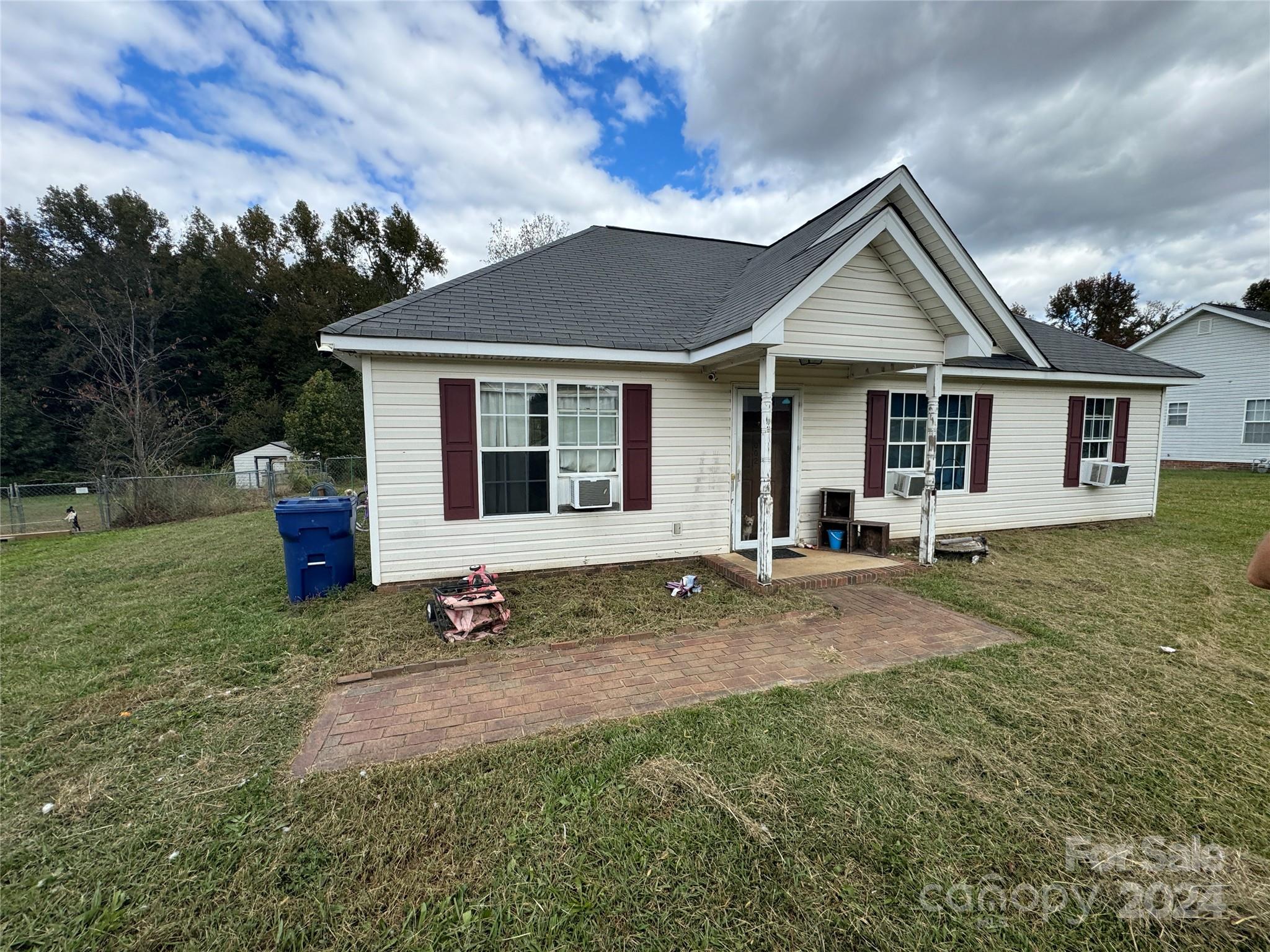 a front view of a house with yard