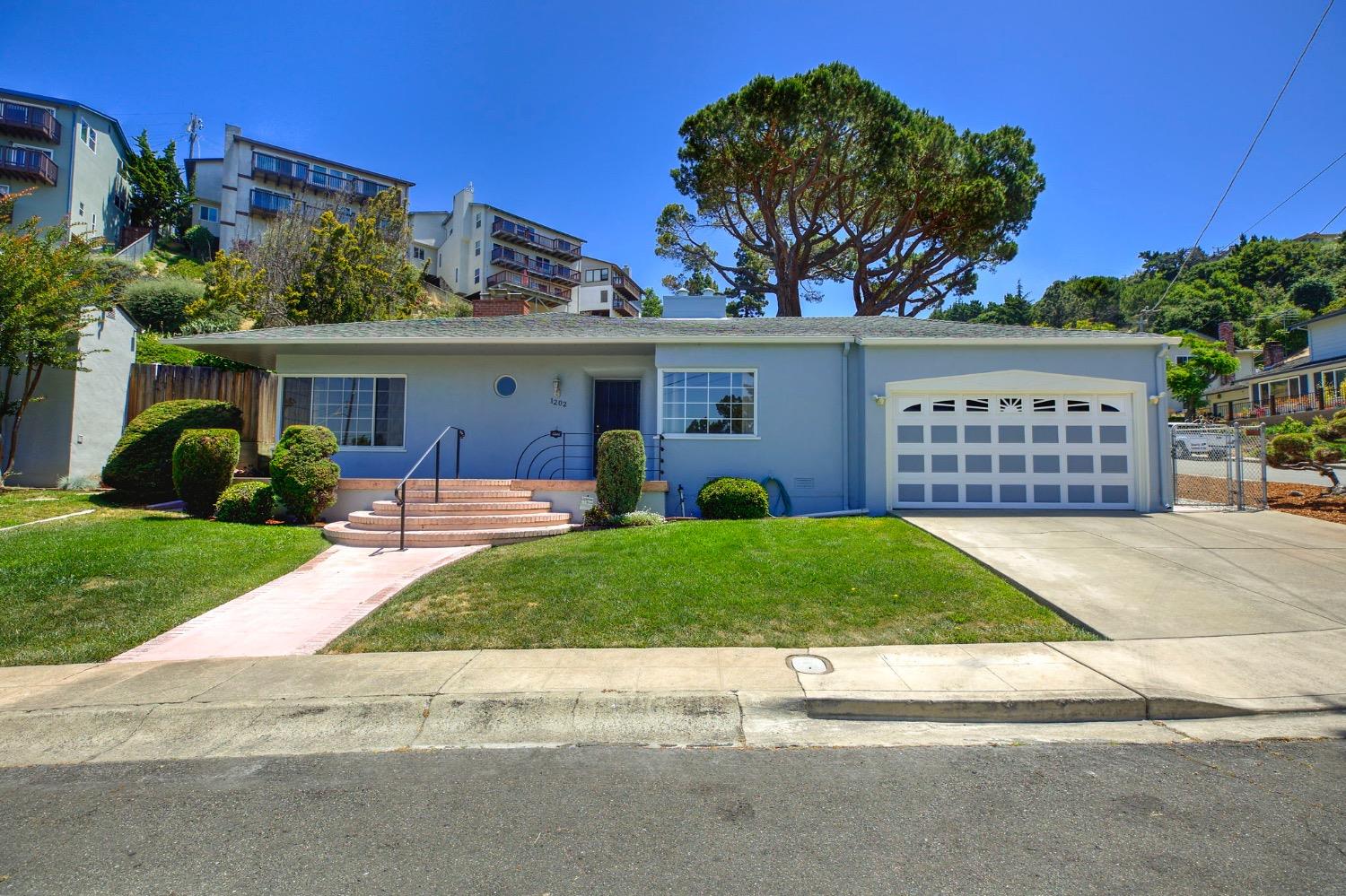 front view of a house with a yard