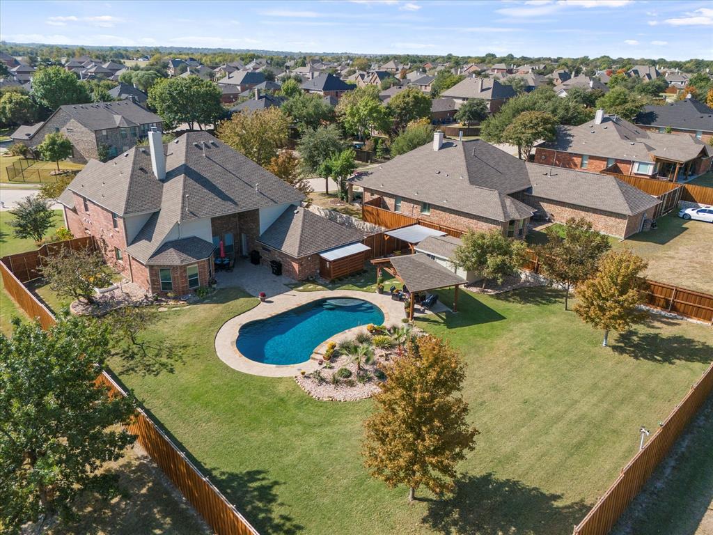 an aerial view of residential house with outdoor space