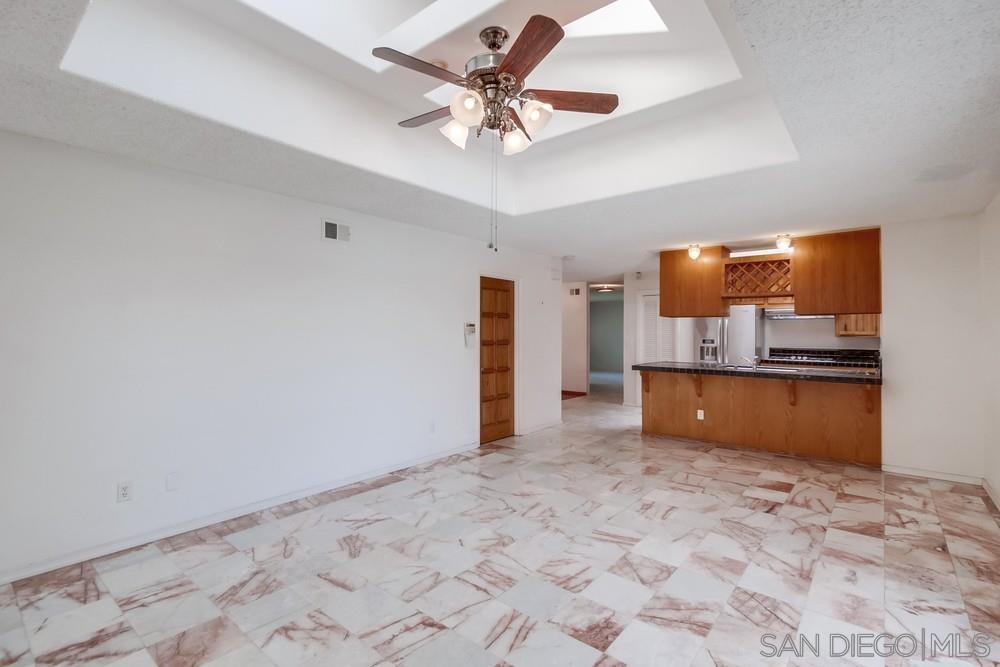 a view of a kitchen with a sink and cabinets