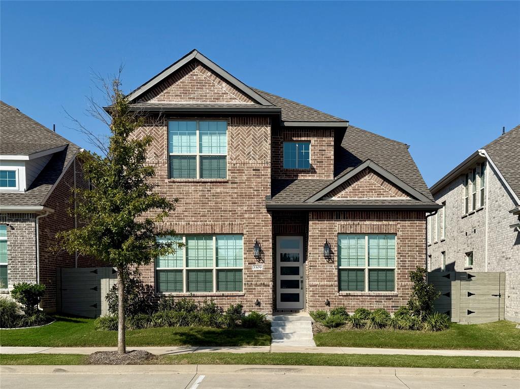 a front view of a house with a yard