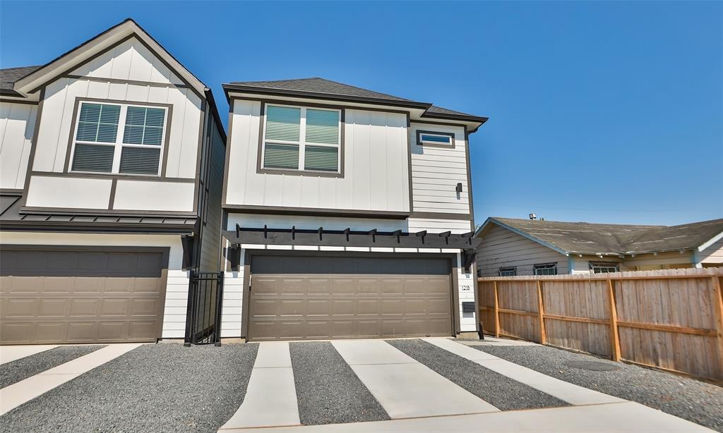 a front view of a house with a garage