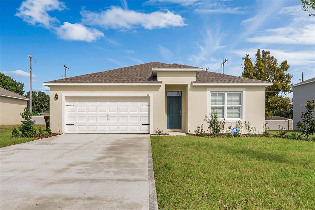 a front view of a house with a yard