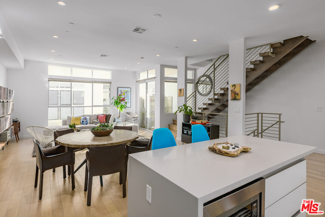 a view of a dining room with furniture and window