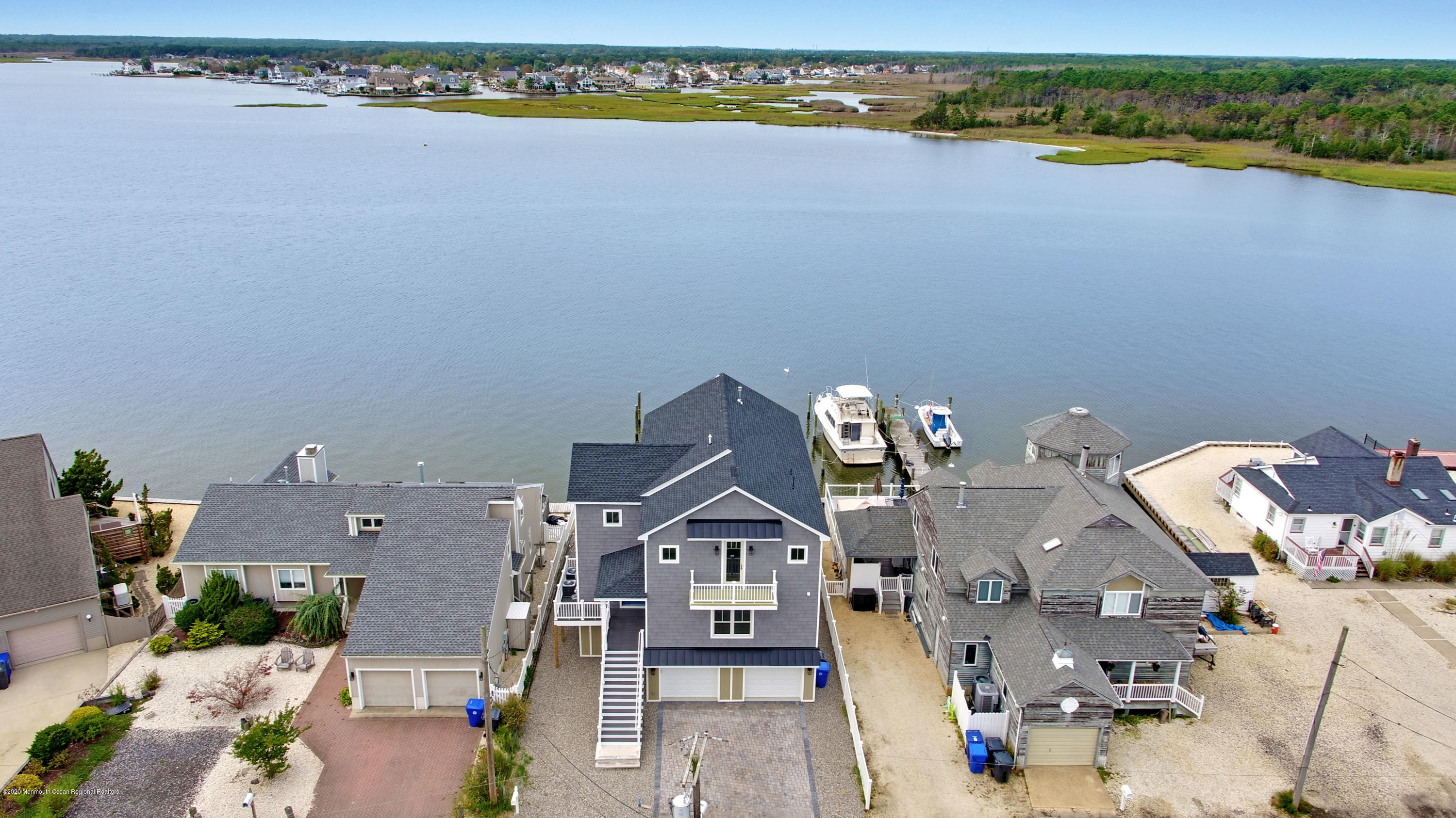 an aerial view of a house with a ocean view