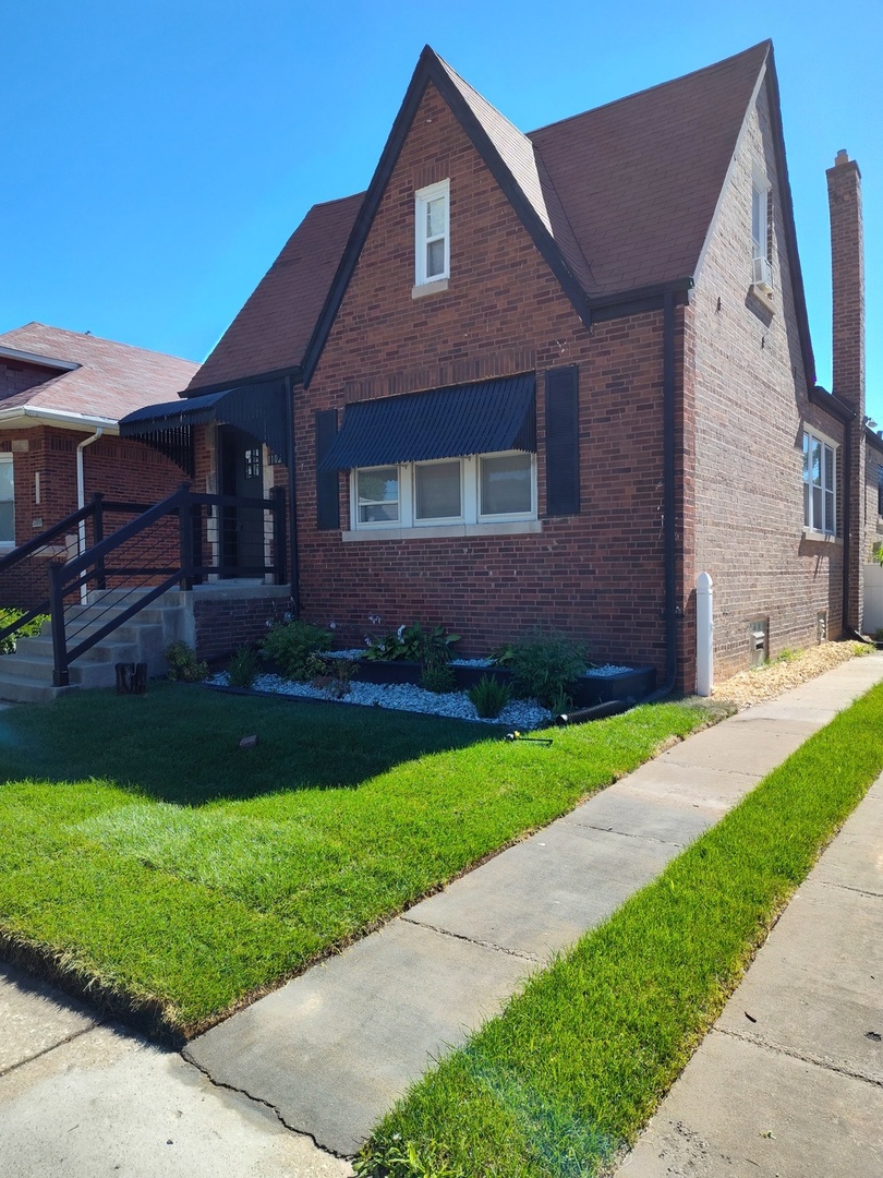 a front view of a house with a yard