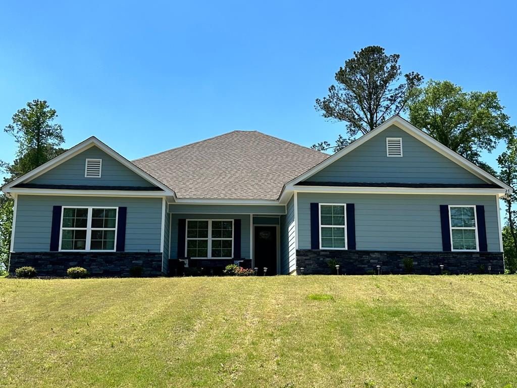 a front view of a house with yard