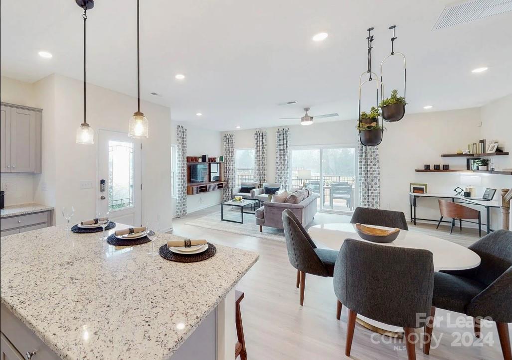 a kitchen with counter space furniture and a ceiling