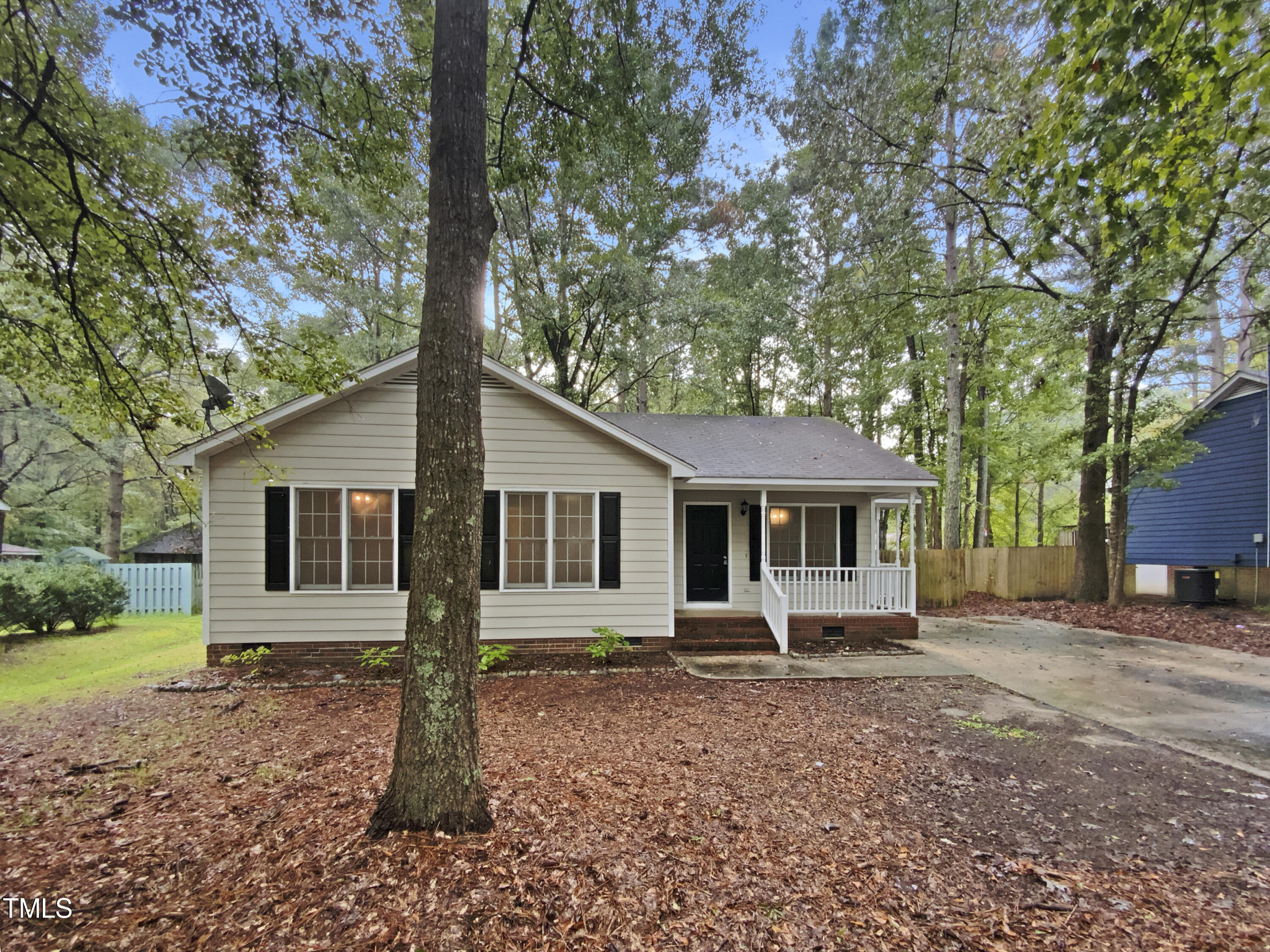 a house with trees in the background