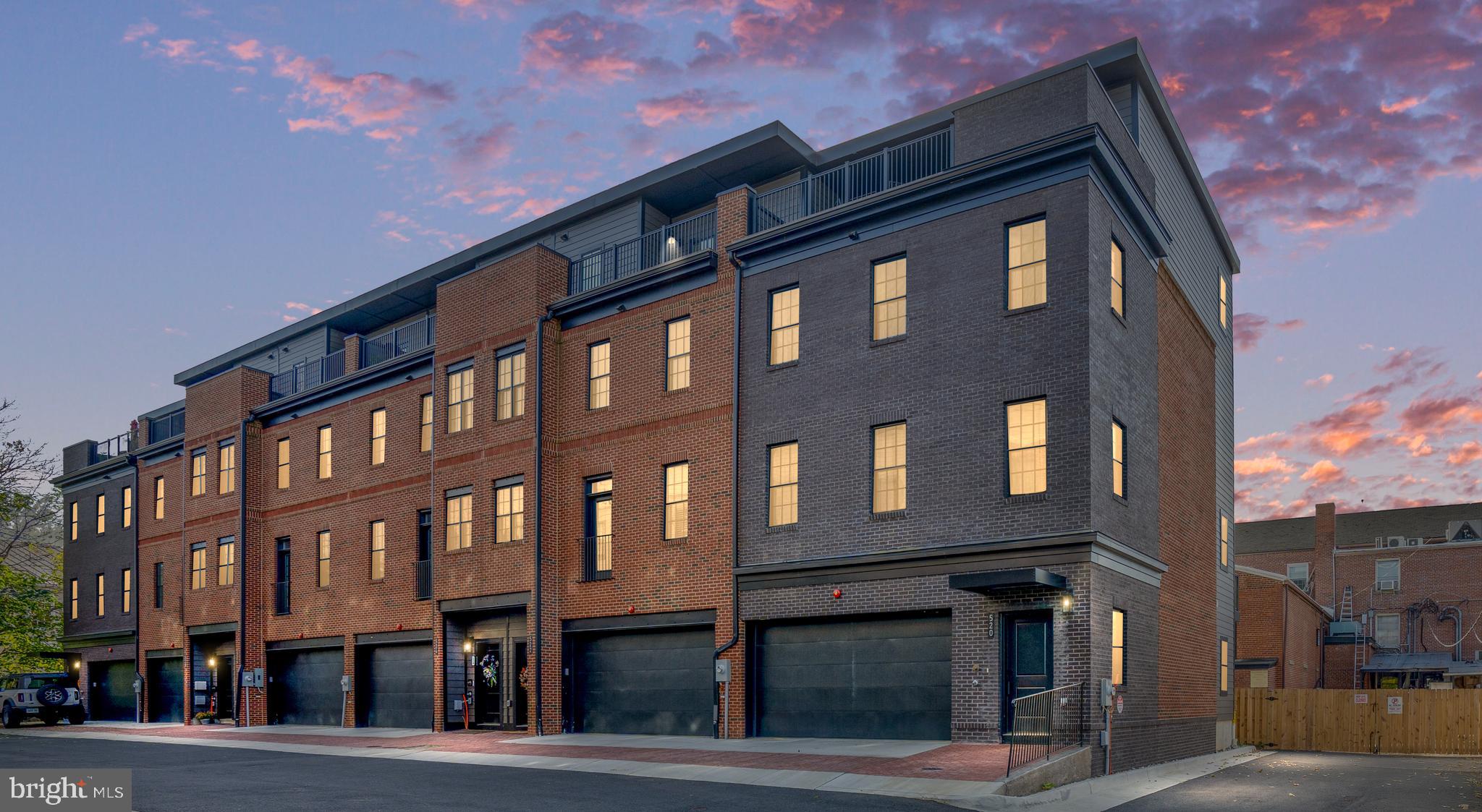 a front view of a building with many windows