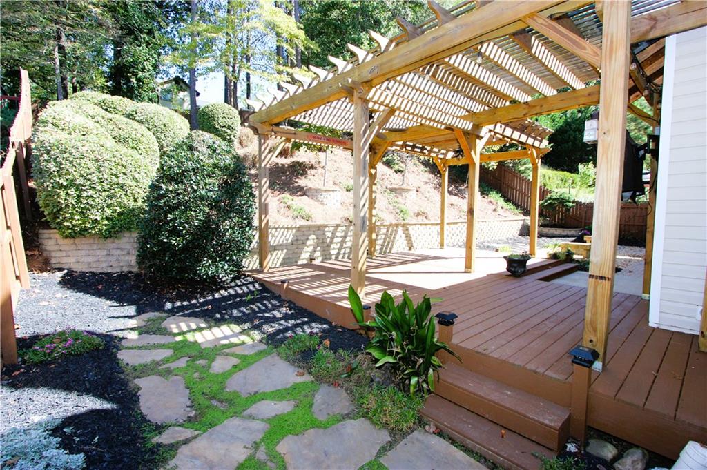 a view of a backyard with sitting area